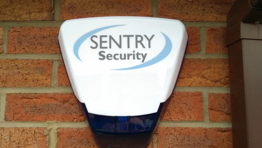 Sentry Security external alarm sounder installed on a brick wall